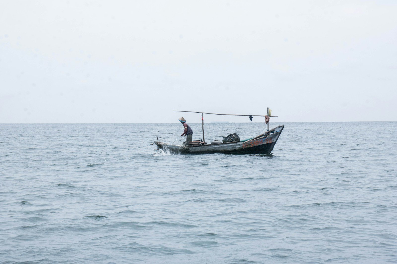 black and red boat on sea during daytime